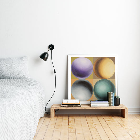 Colorful geometric art print with spheres in a white bedroom.