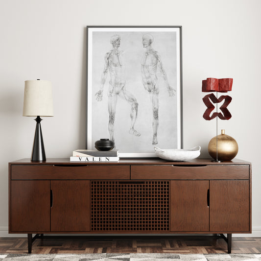 Black and white anatomy art print on a sideboard.