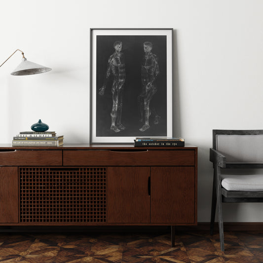 Black and white human body anatomy art print in an eclectic interior.