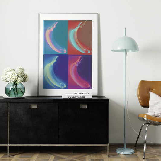 Pop art style art print with banana, on a black sideboard.