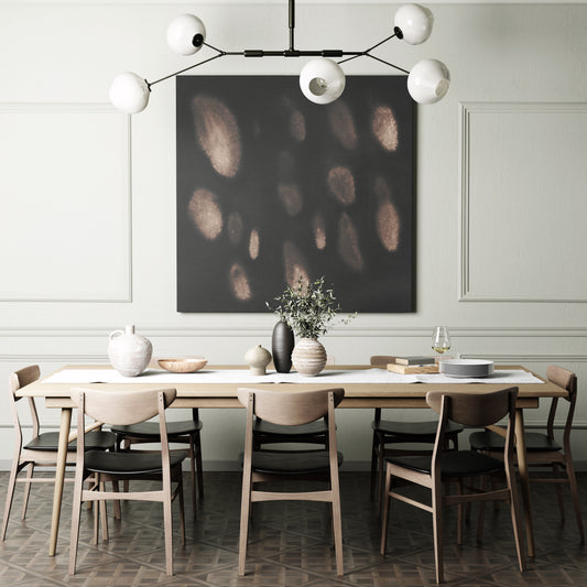 Dark abstract art print in watercolor technique, on a wall in a moody dining room.