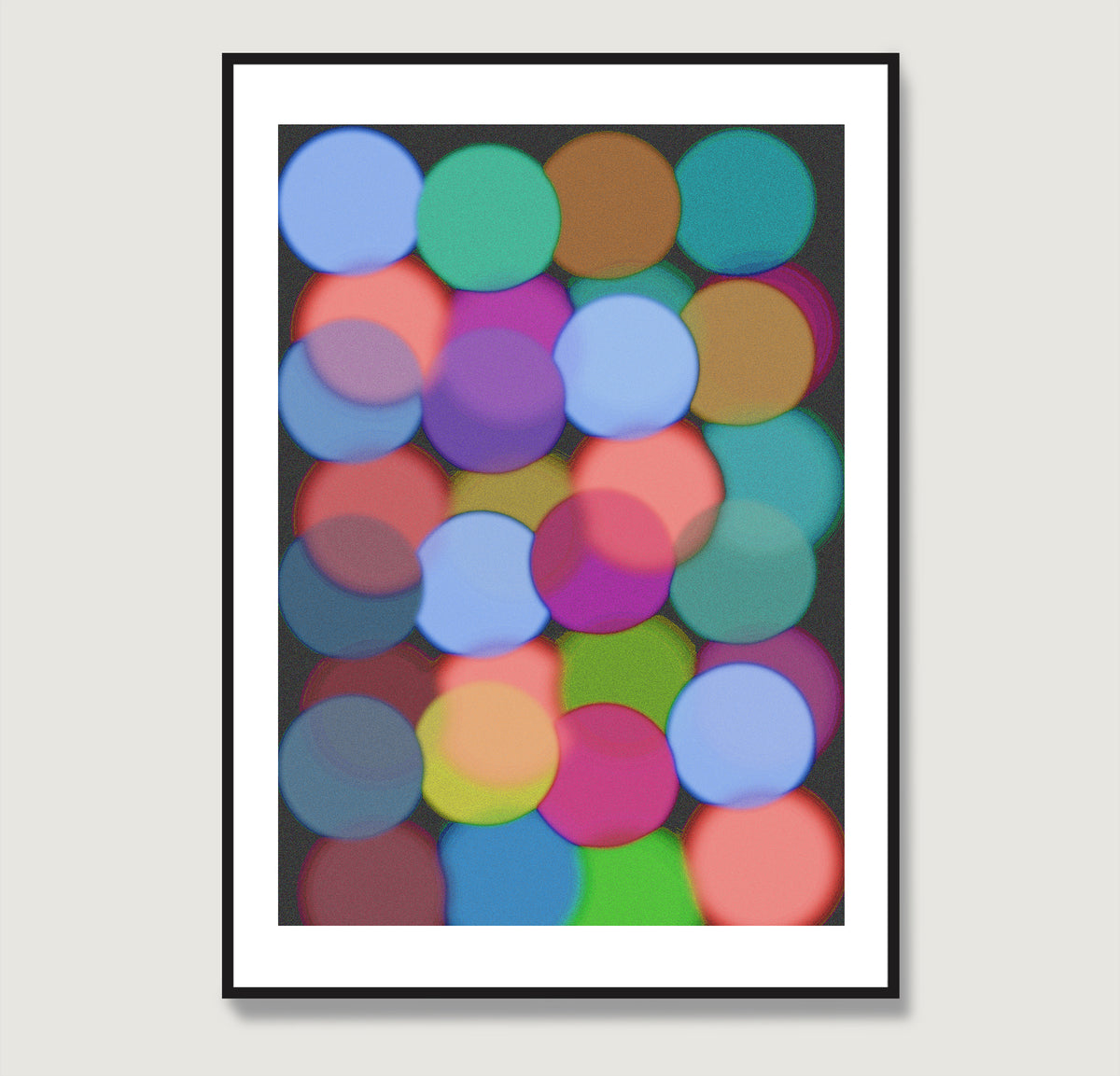 Framed abstract art with colorful circles on a black background.