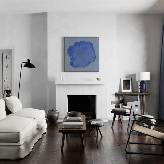 Blue minimalist abstract contemporary art print above the fireplace of a large living room.