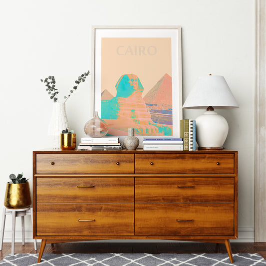 Travel poster Cairo landmark colorful art print on a mid-century modern sideboard.