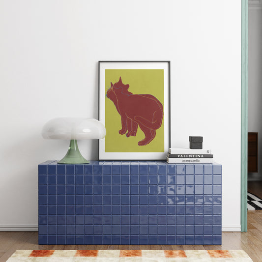 Framed art print with a cat in a modern interior.