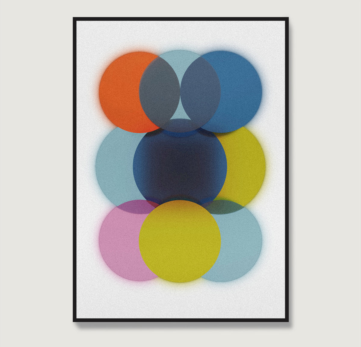 Framed abstract art print with colorful circles on a light gray background.