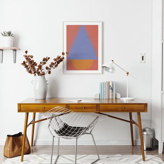Colorful abstract geometric graphic art print in a bright home office.