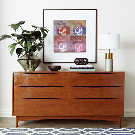Pop art art print with cookies, above a vintage sideboard.