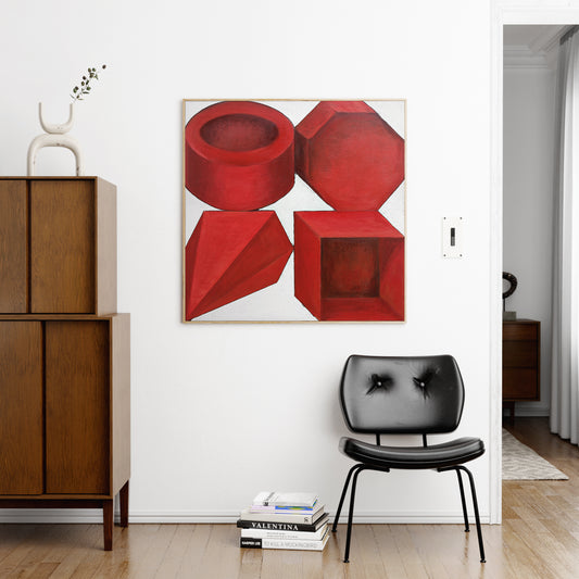 Red geometric shapes on a white background art print in a minimalist interior.