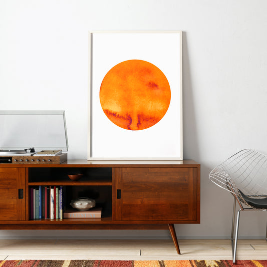 Orange planet minimalist graphic art print in a vintage style interior.