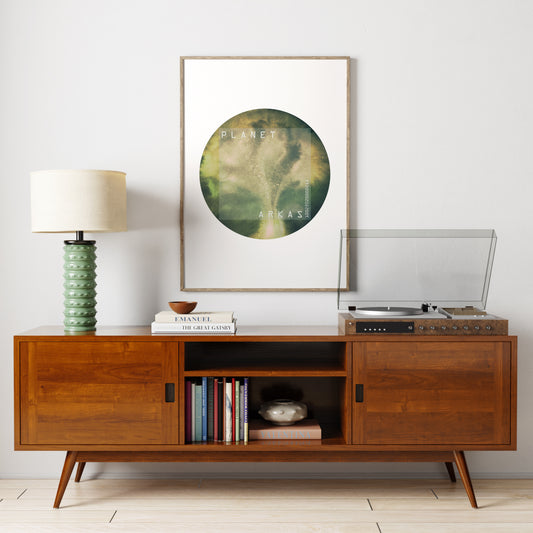 Green planet minimalist watercolor graphic art print in a vintage style interior.