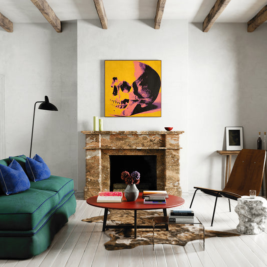 Intense yellow skull pop art art print in a large eclectic living room.
