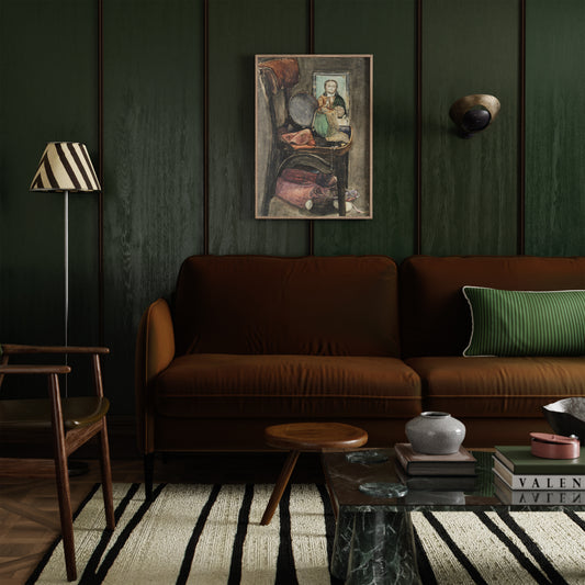 Figurative framed art print on a green wood wall in an eclectic modern living room with a brown sofa, striped rug, and marble coffee table.