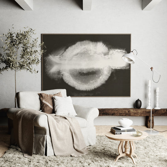 Abstract black and white art print in a cozy, natural interior.