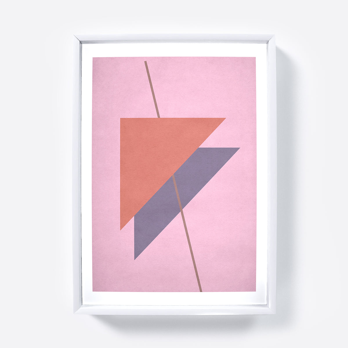 Framed abstract art print with geometric shapes on a pink background