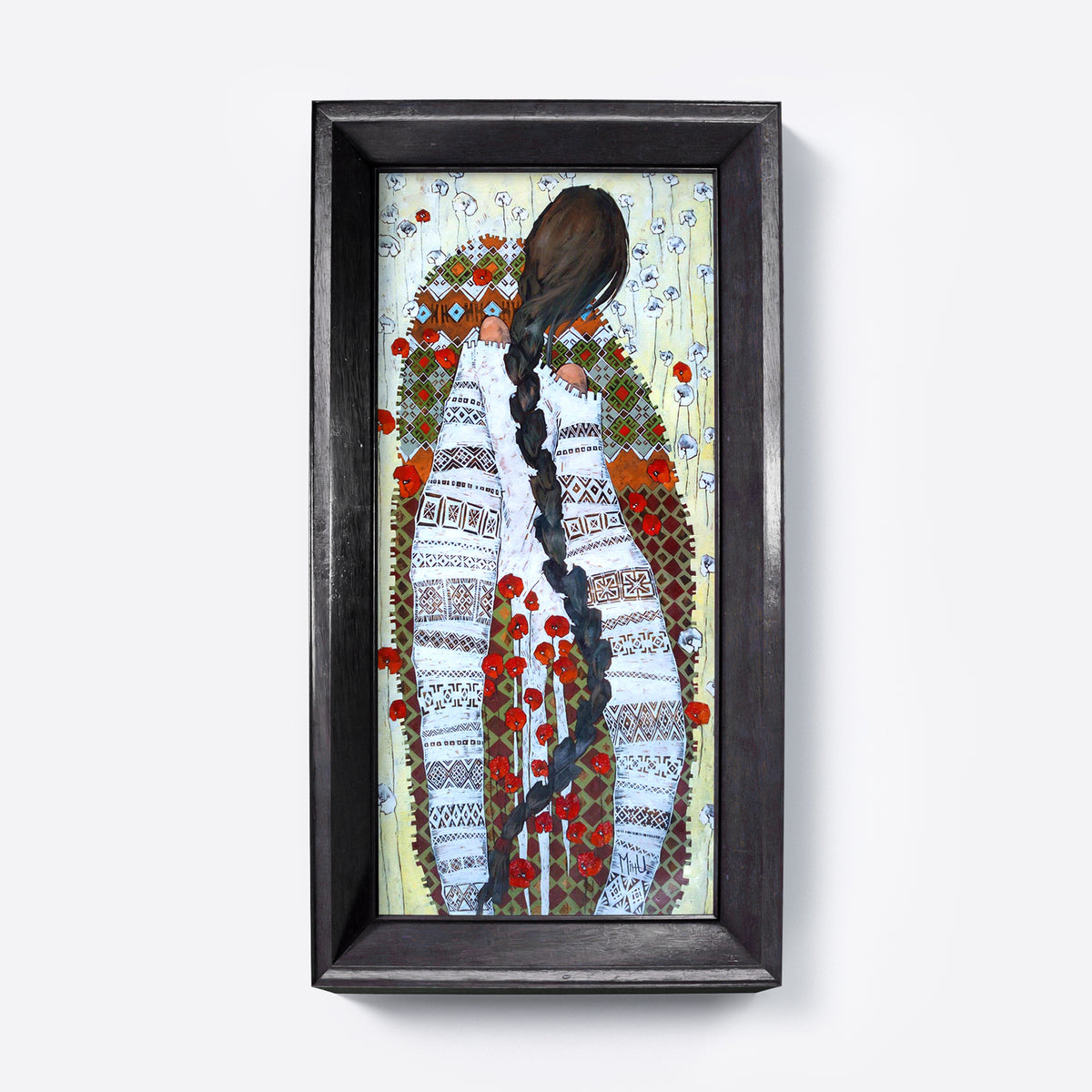 Framed artwork of a stylized figure with braided hair and floral patterns on a white background