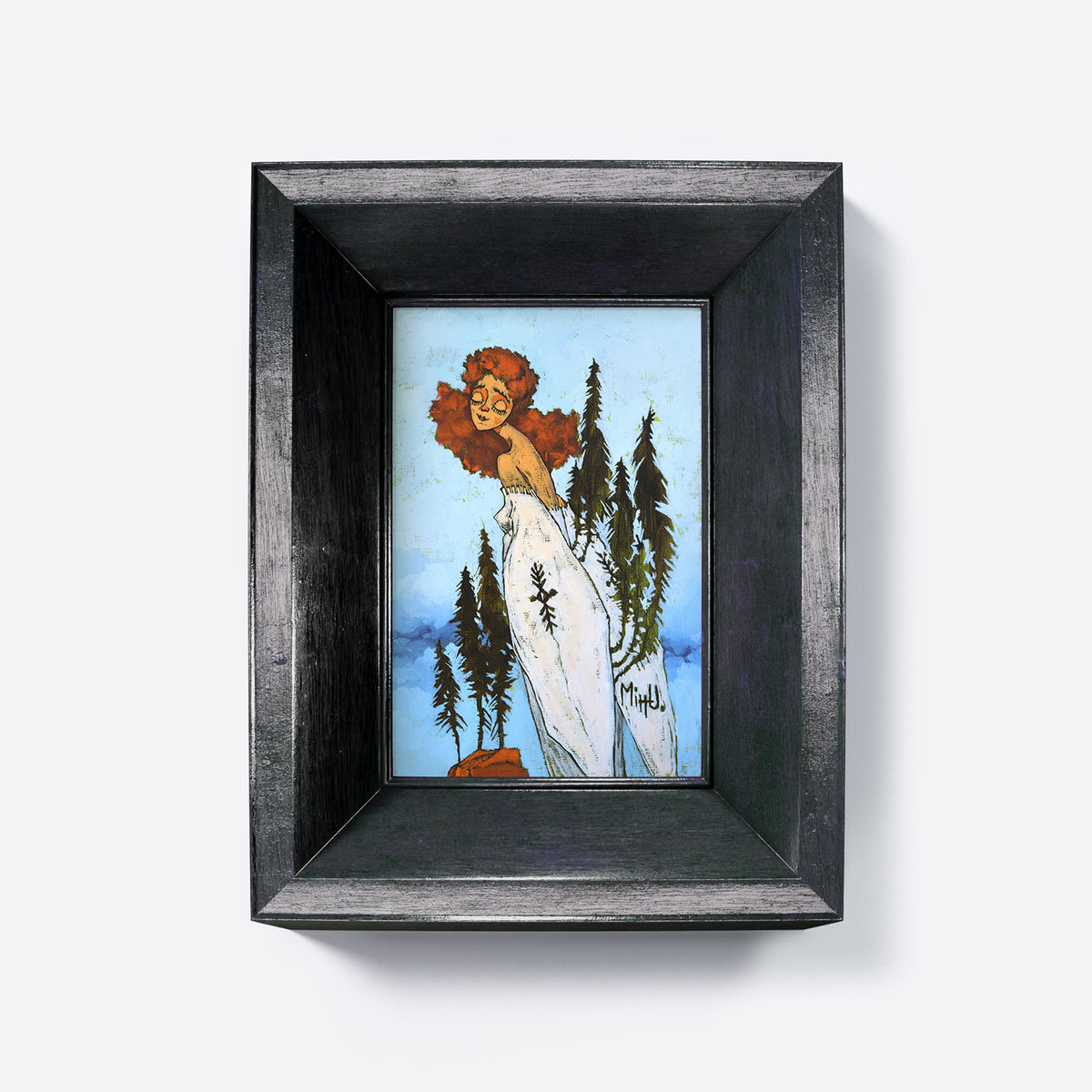 Framed artwork of a woman with red hair and a white dress on a blue sky background.