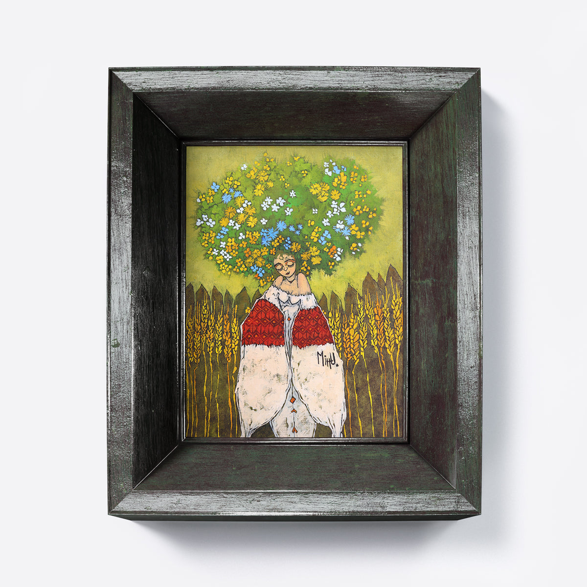 Framed artwork of a person with flowers on their head against a wooden fence.