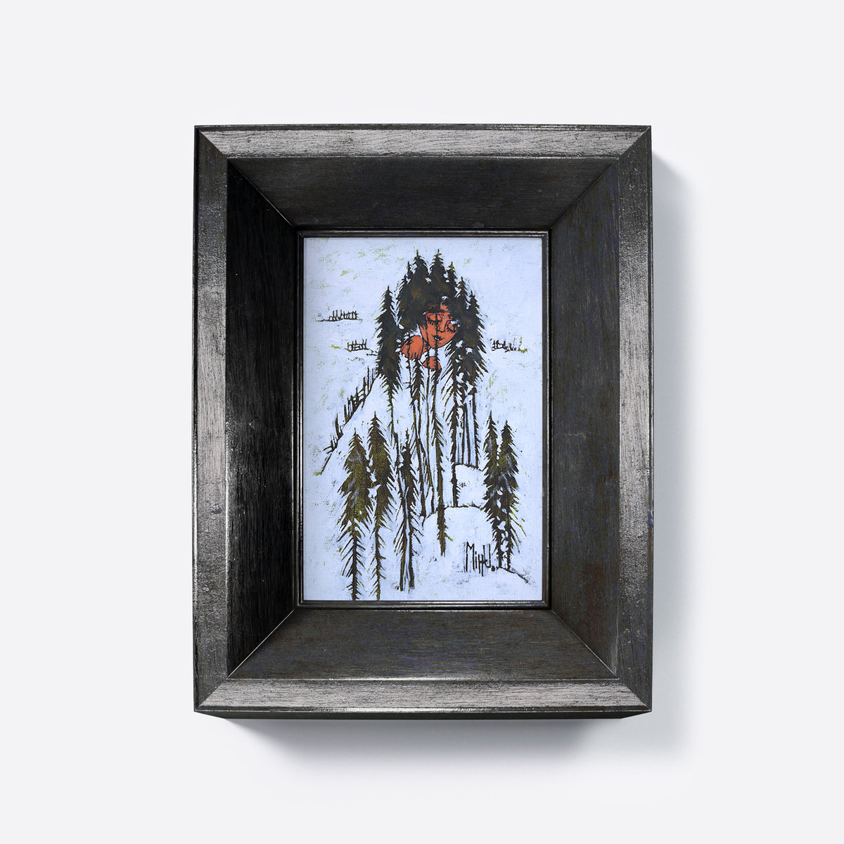 Framed artwork of a person in a snowy forest with a black frame.
