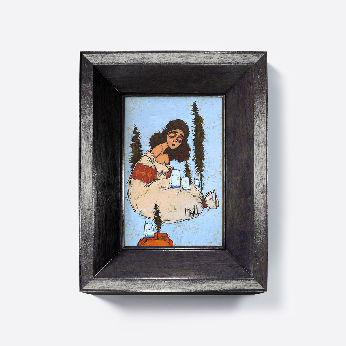 Framed artwork of a stylized depiction of a figure and trees on a light blue background.