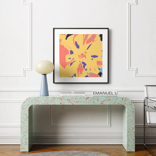Colorful pop art print with flower, above a modern sideboard in a bright interior.