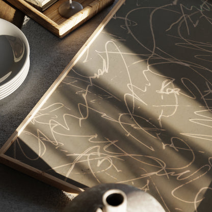 Monochrome abstract art print in a moody space.