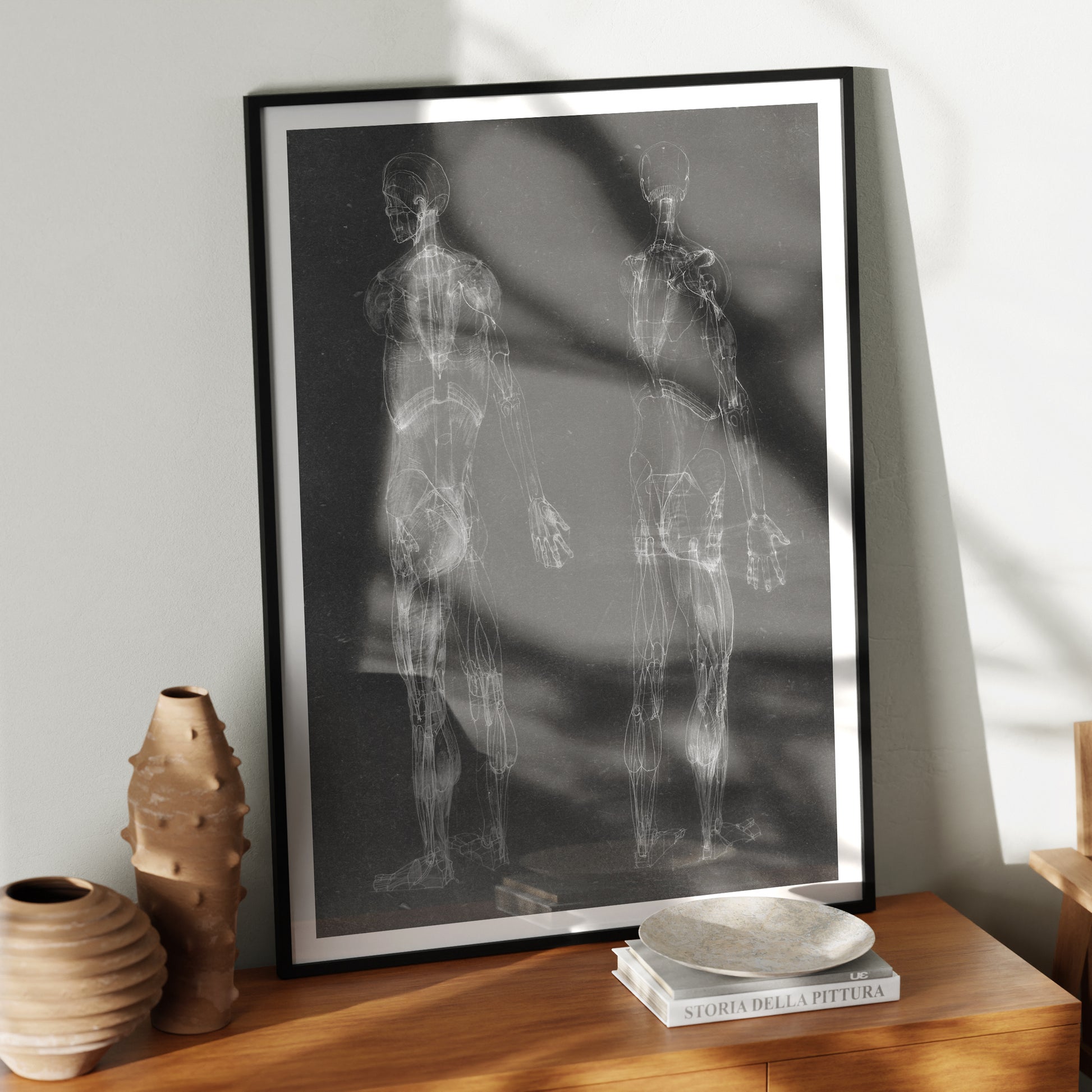 Black and white human body anatomy art print with two standing figures in a moody ambient.