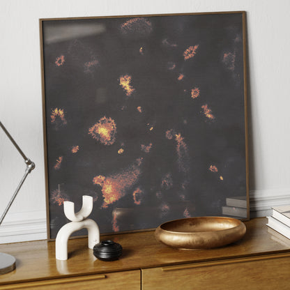 Dark abstract art print in watercolor technique, on an elegant sideboard.