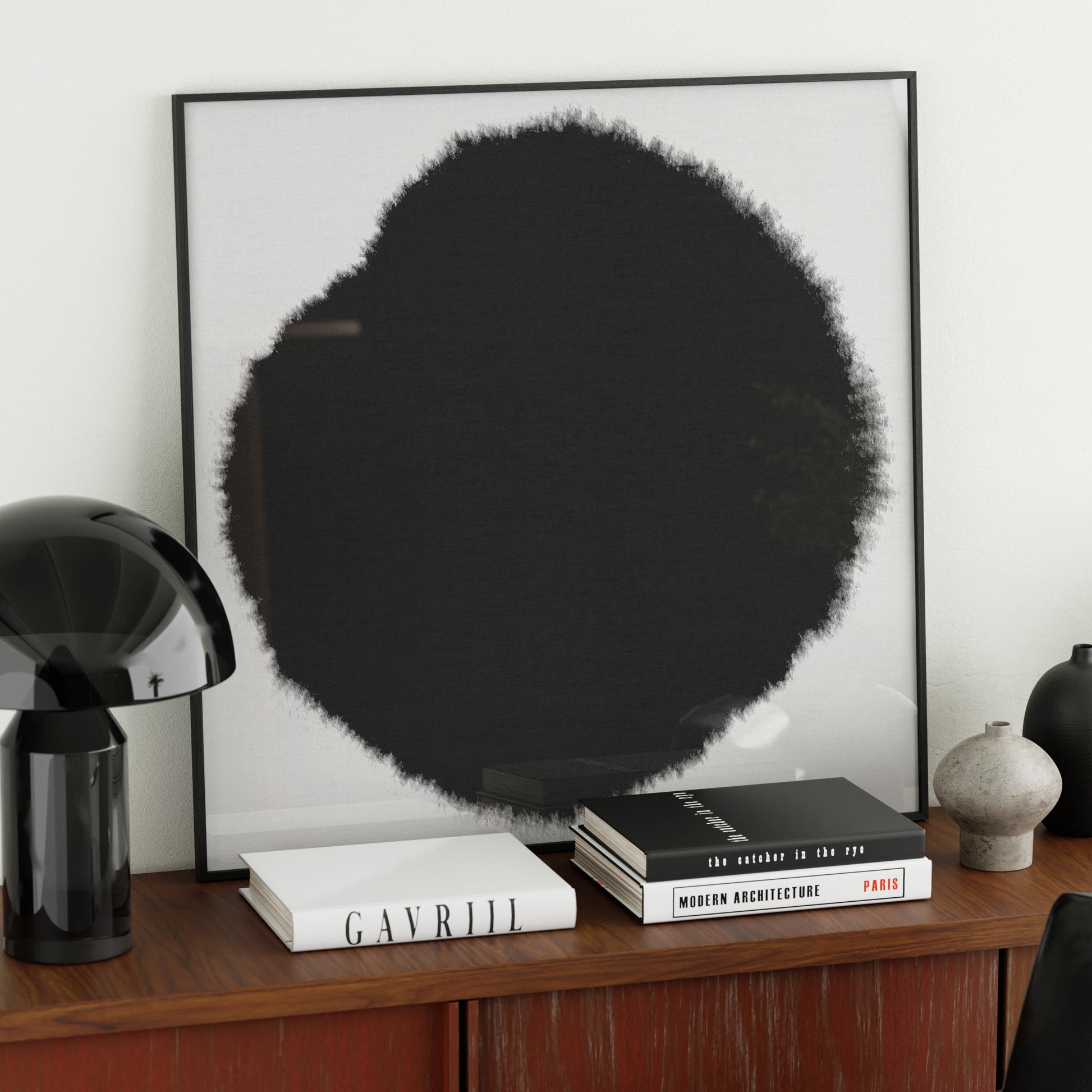 Abstract minimalist black and white art print on a sideboard.