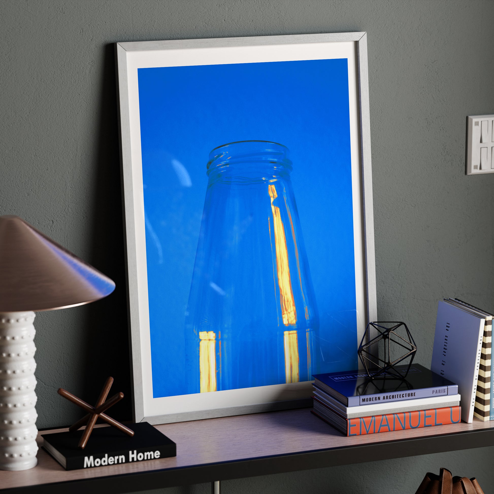 Minimalist blue art print on a modern sideboard.