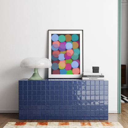 Blue tiled cabinet with a colorful abstract art print on a white wall.