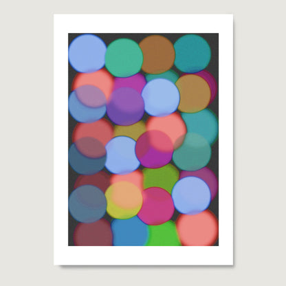 Colorful abstract pattern of circles on a dark background.