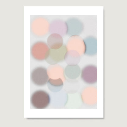 Art print on paper with pastel colored dots on a light gray background.