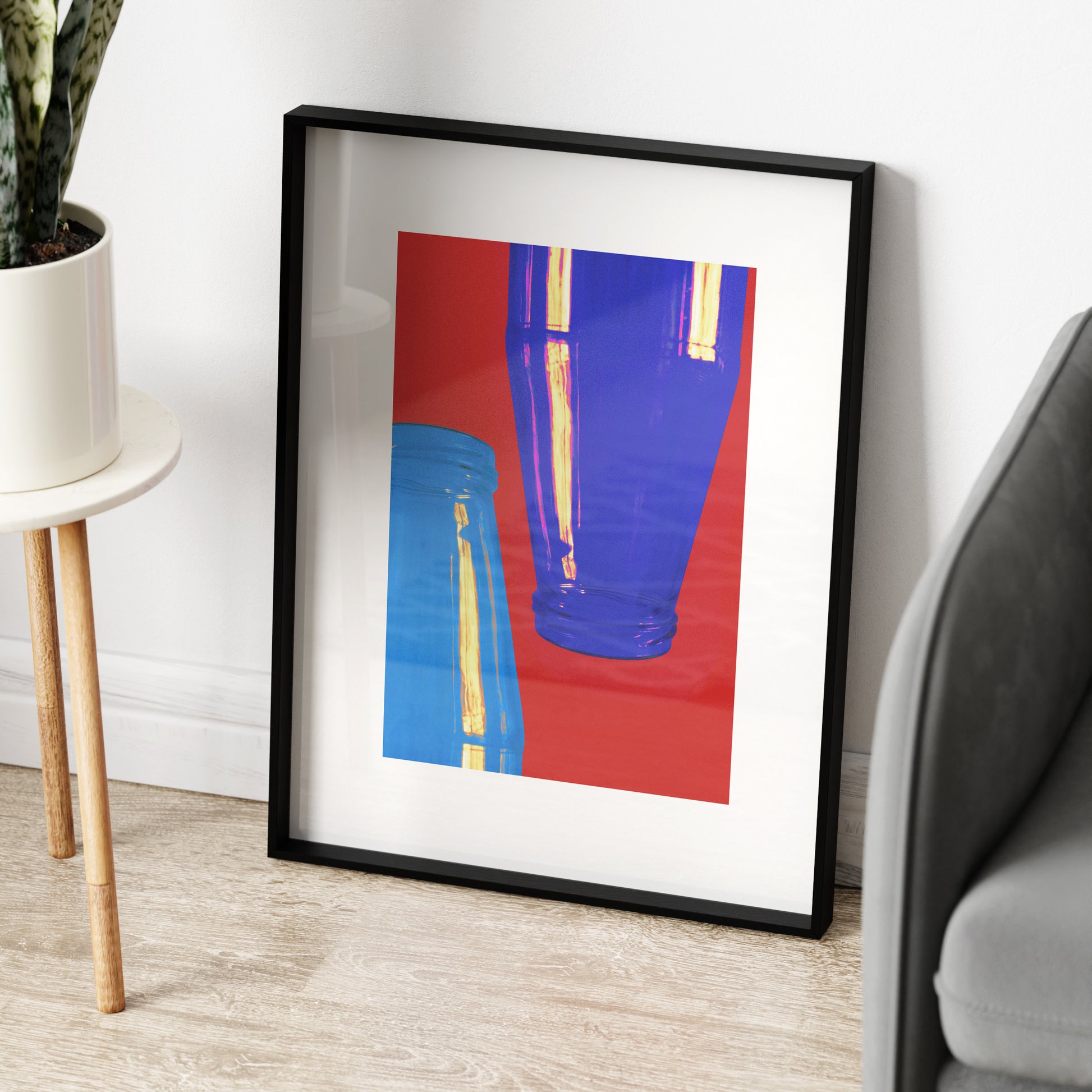 Minimalist graphic art print with bright red and blue colors.