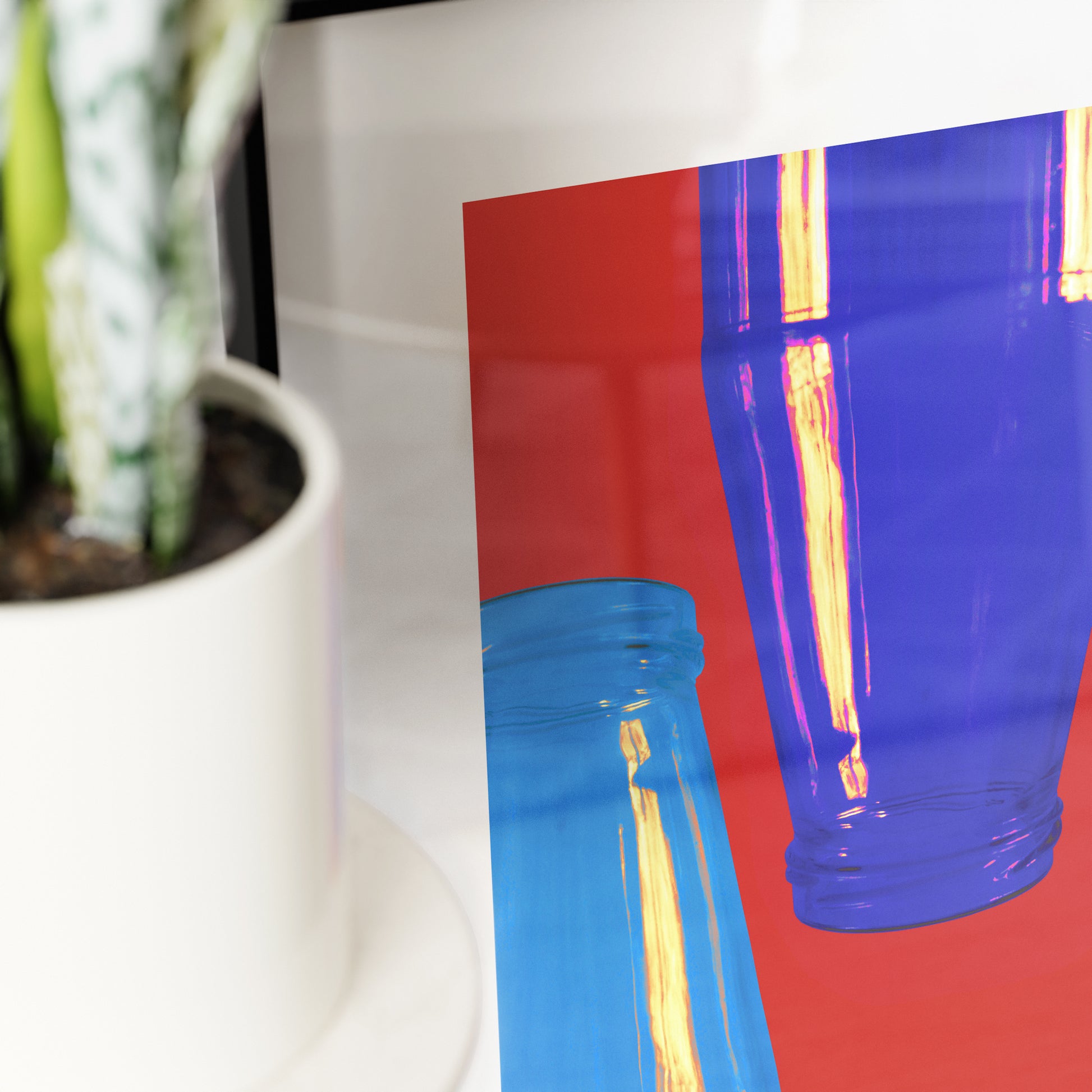 Detail of a minimalist graphic art print with bright red and blue colors.