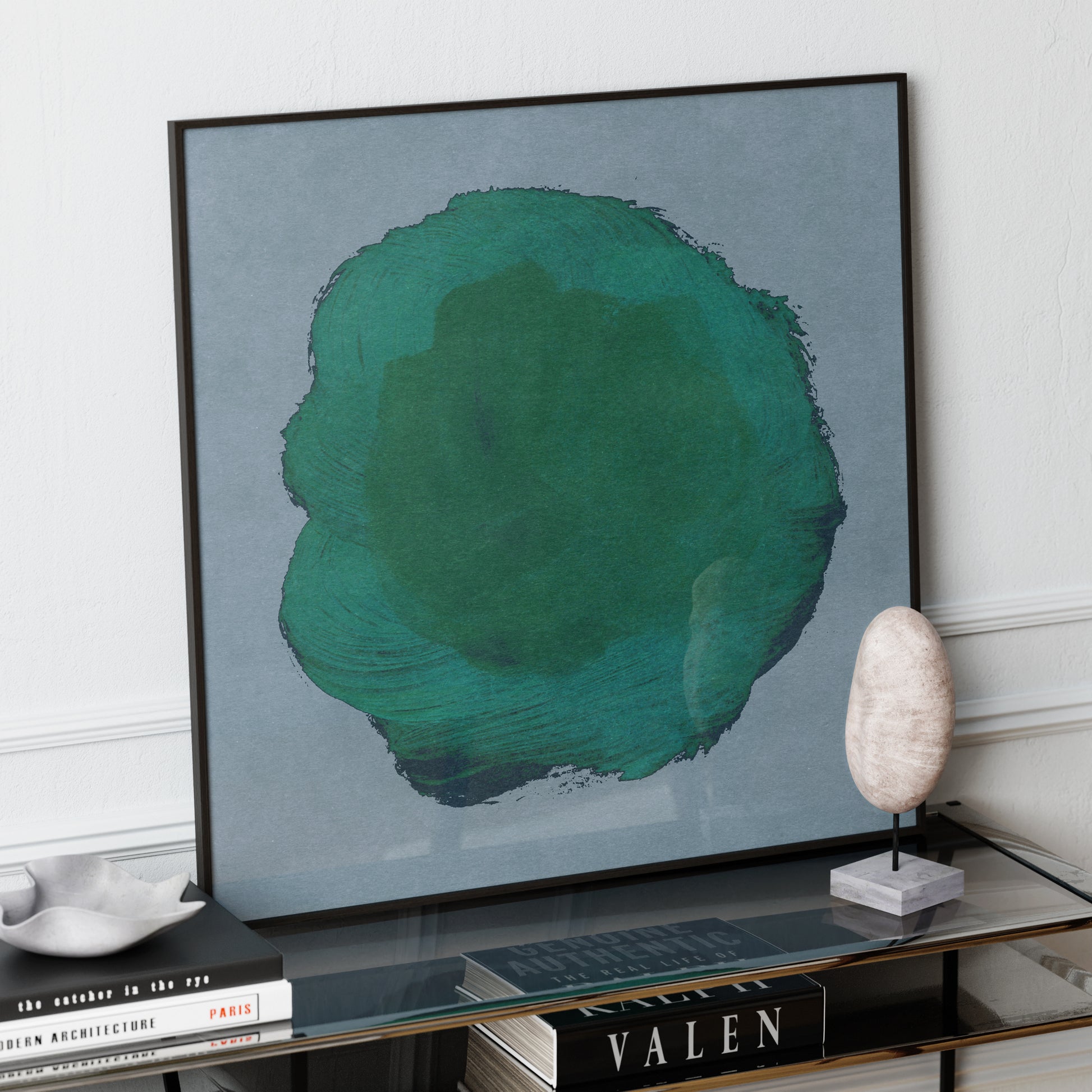 Emerald green abstract contemporary art print on a glass sideboard.