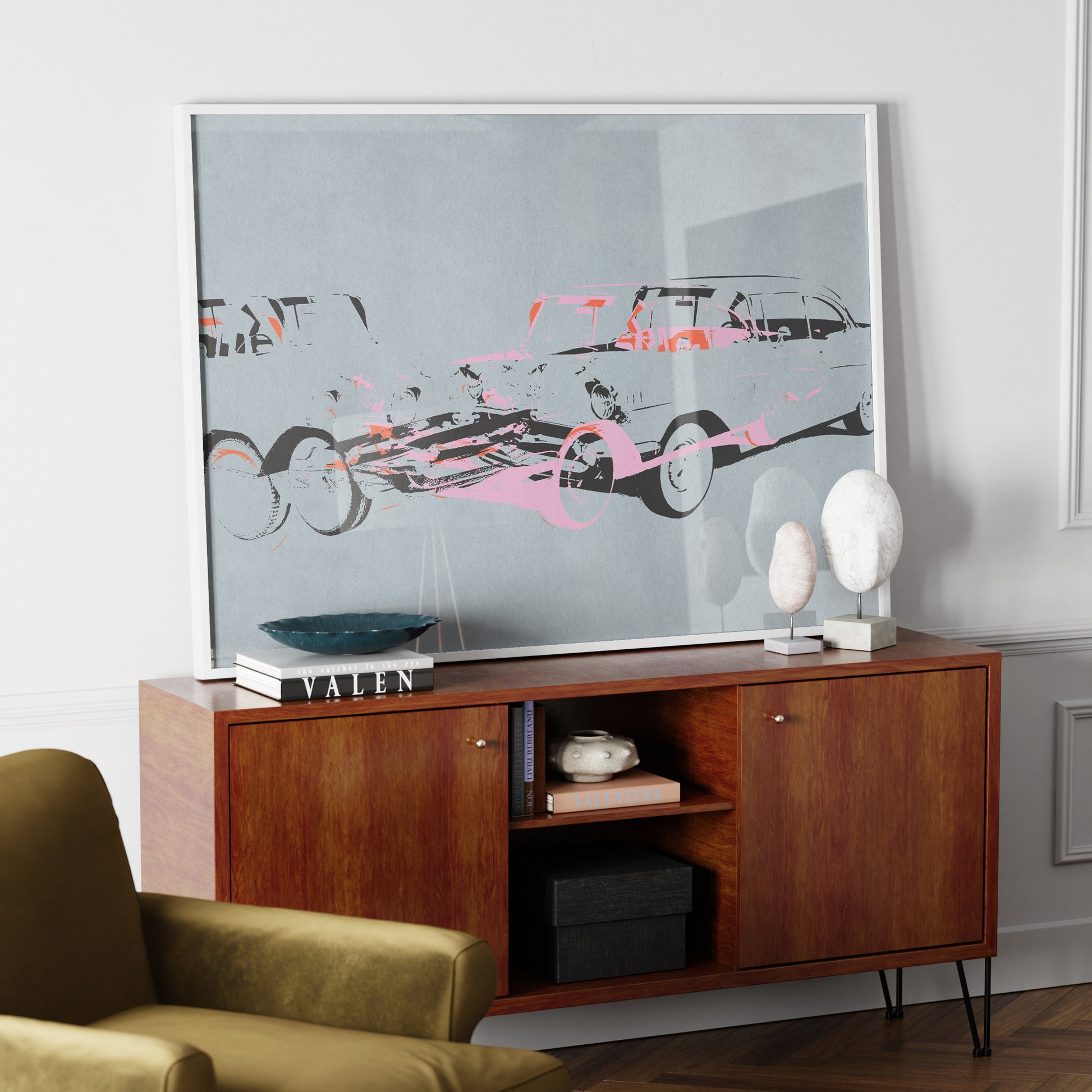 Pop art car crash on blue art print on a wood sideboard in a luxury interior.