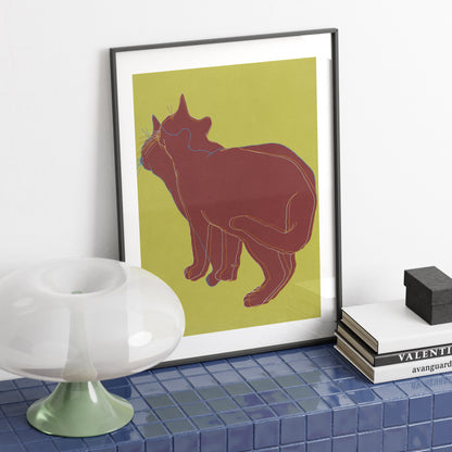 Art print with a cat on a sideboard with blue tiles.