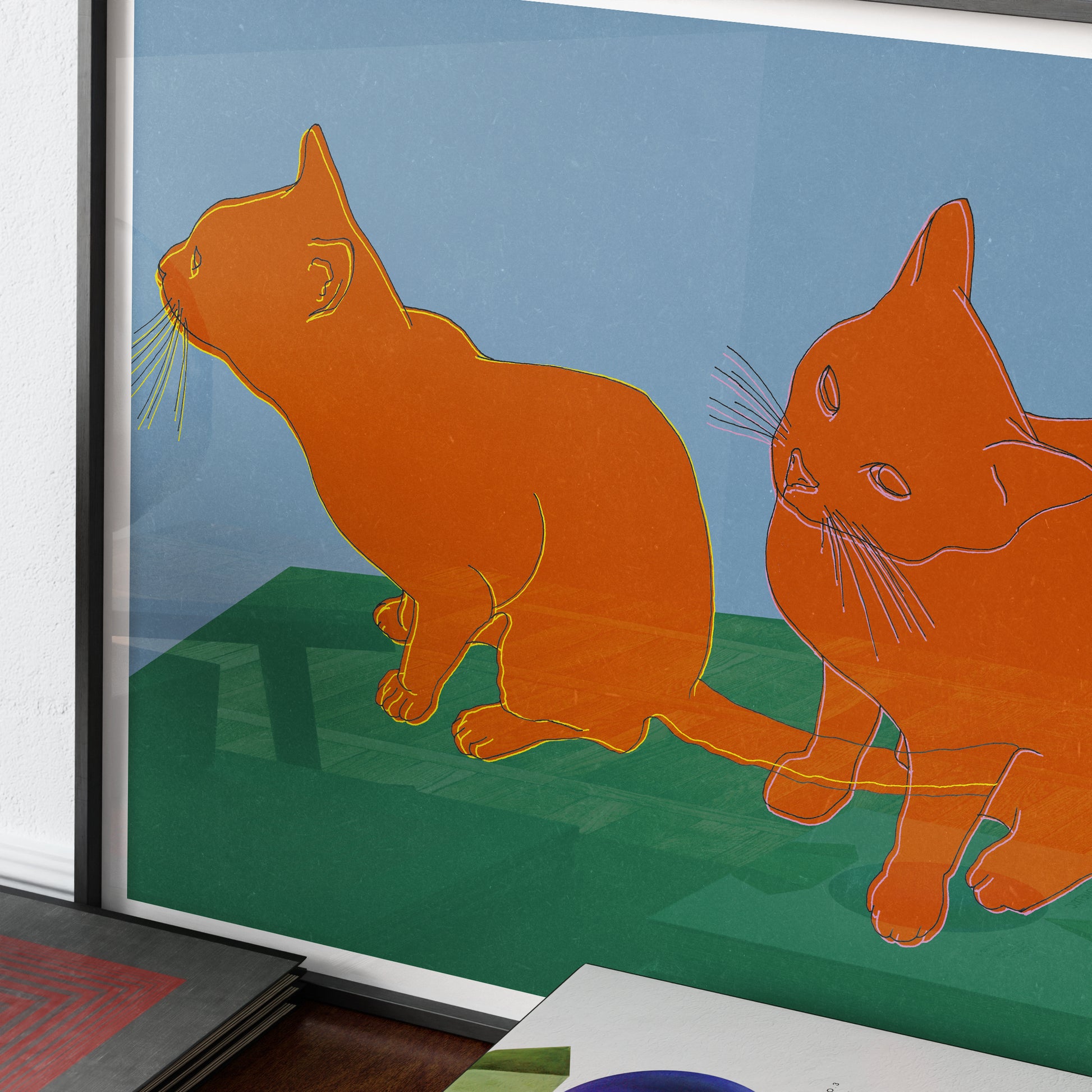 Detail of an art print with two cats.