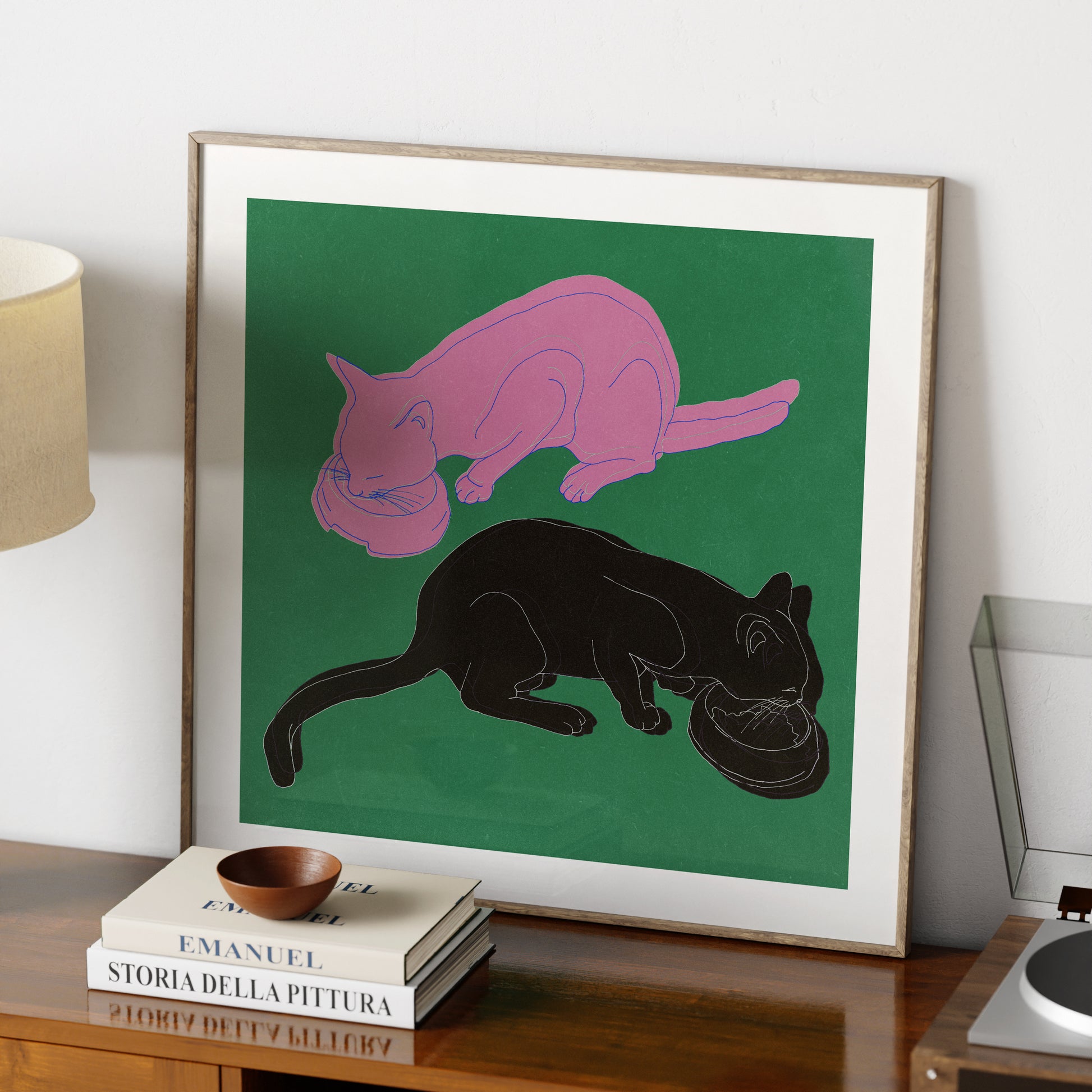 Art print with two cats on a green background.