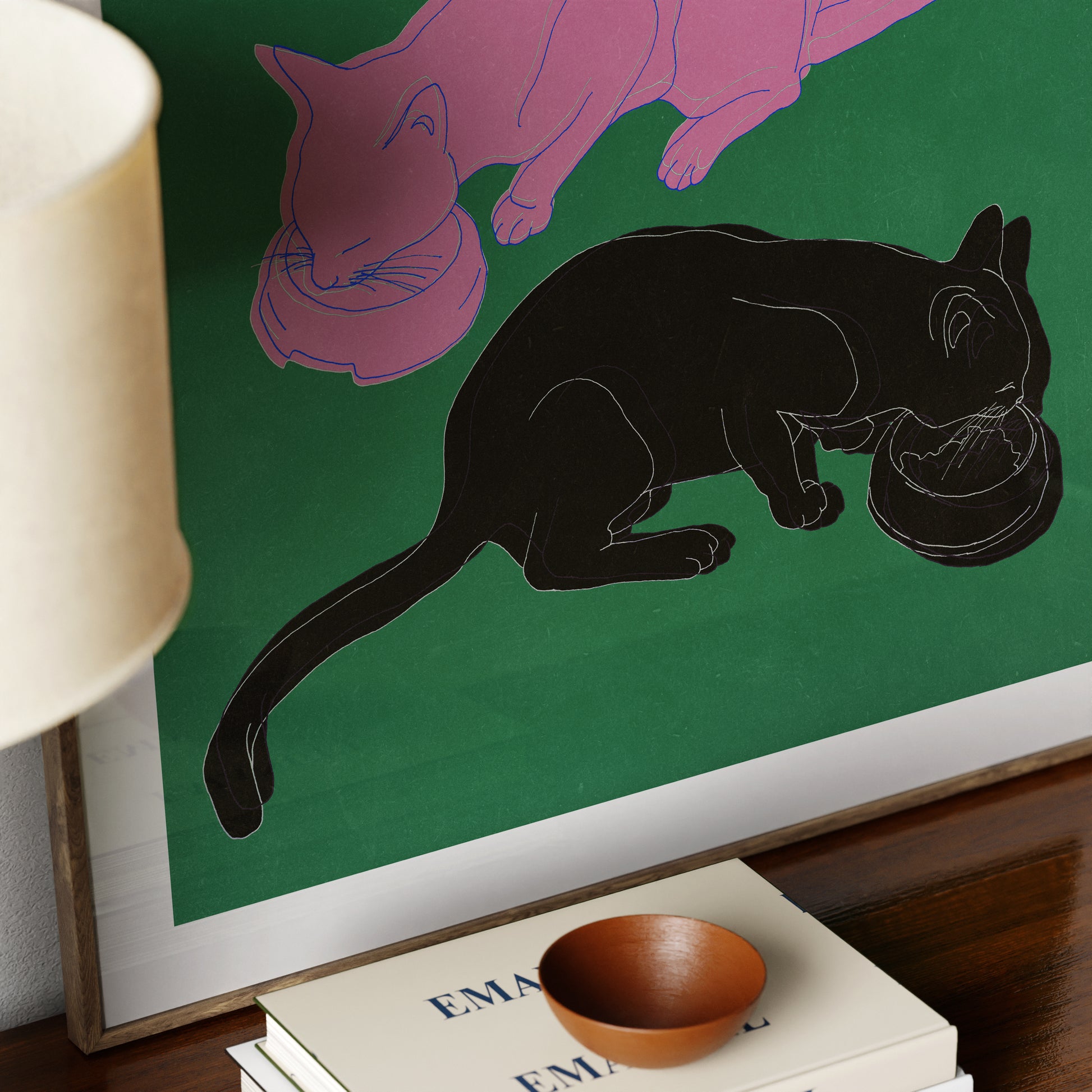Detail of an art print with two cats eating.