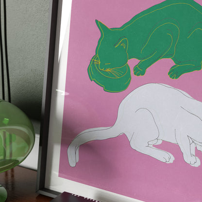 Detail of an art print depicting two cats on a pink background.