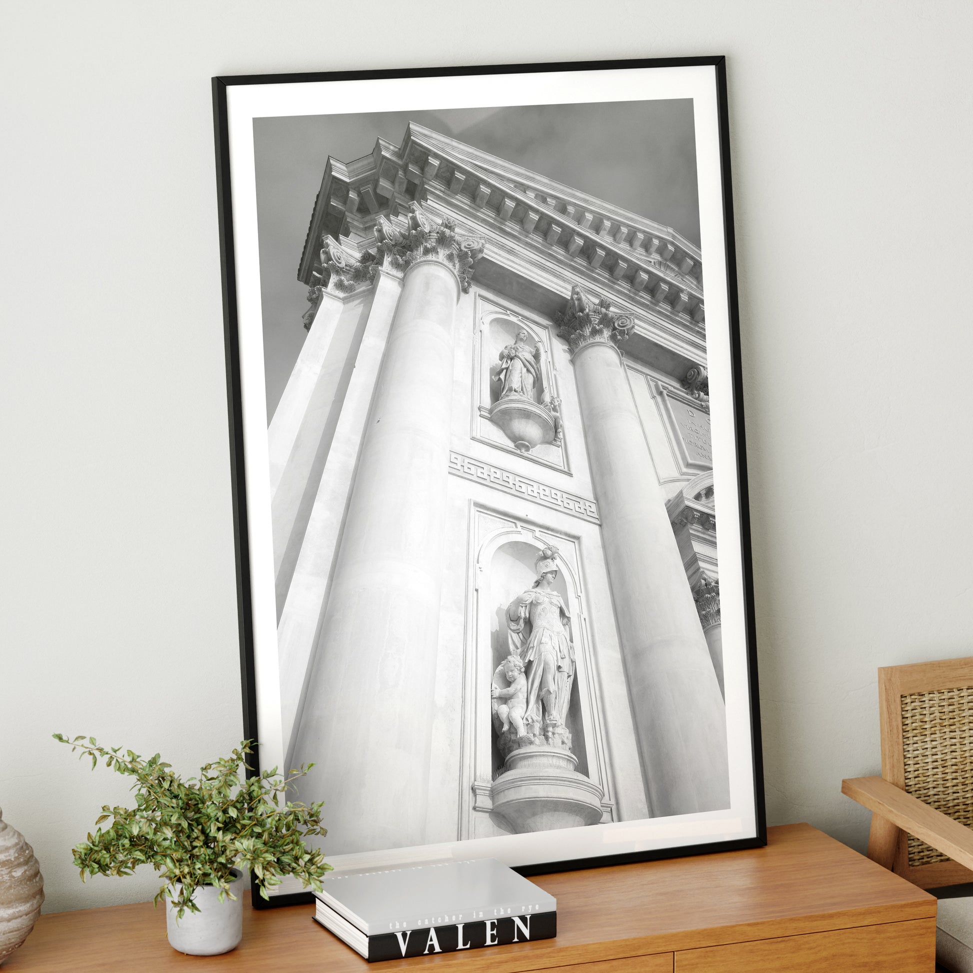 Architectural photography of a Venetian church, black and white art print on a wood sideboard.