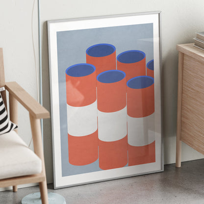 Red and blue graphic art print in a metallic frame.