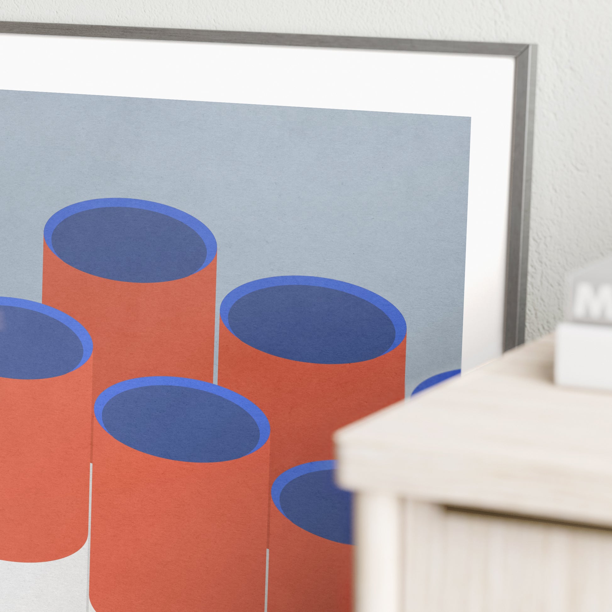 Detail of a red and blue graphic art print.