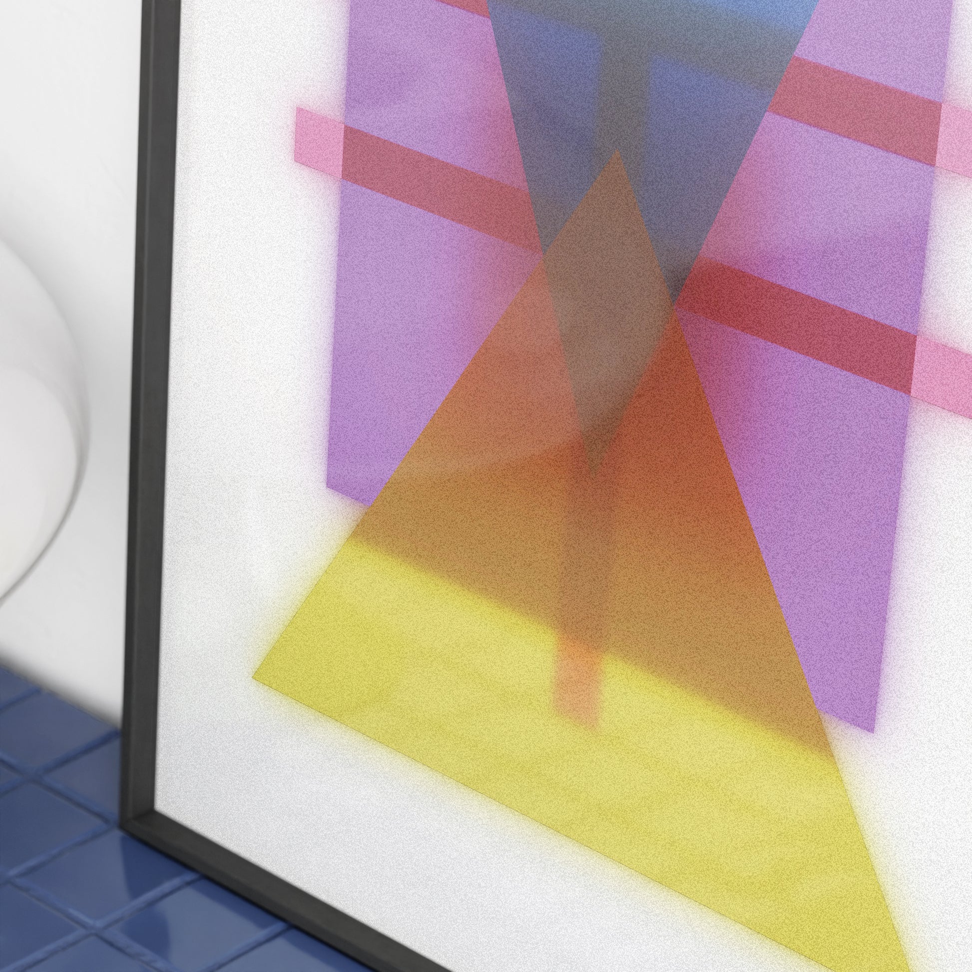Framed abstract art with geometric shapes in purple, orange, and yellow on a white background.
