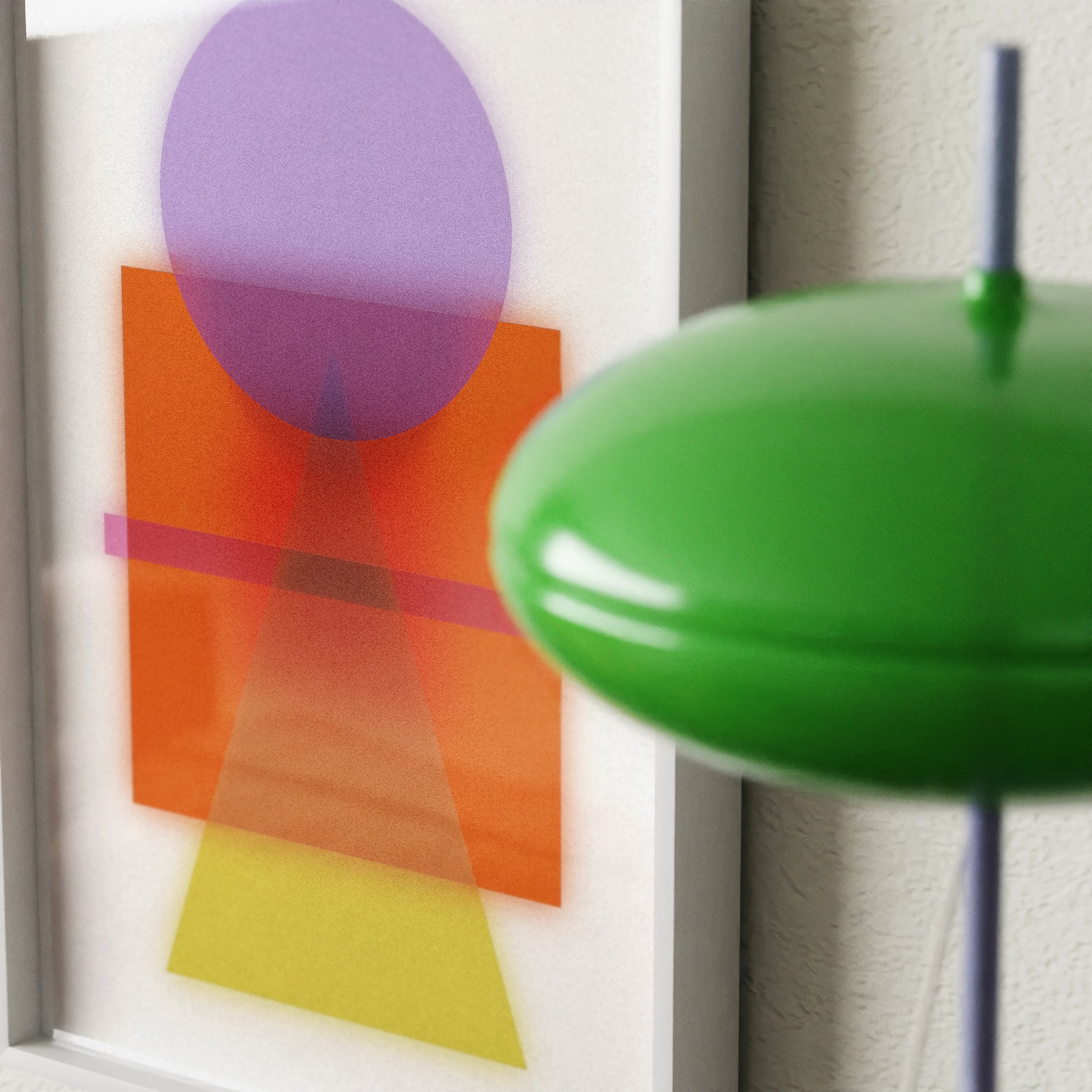 Abstract art with colorful shapes on a white background, green lampshade in foreground