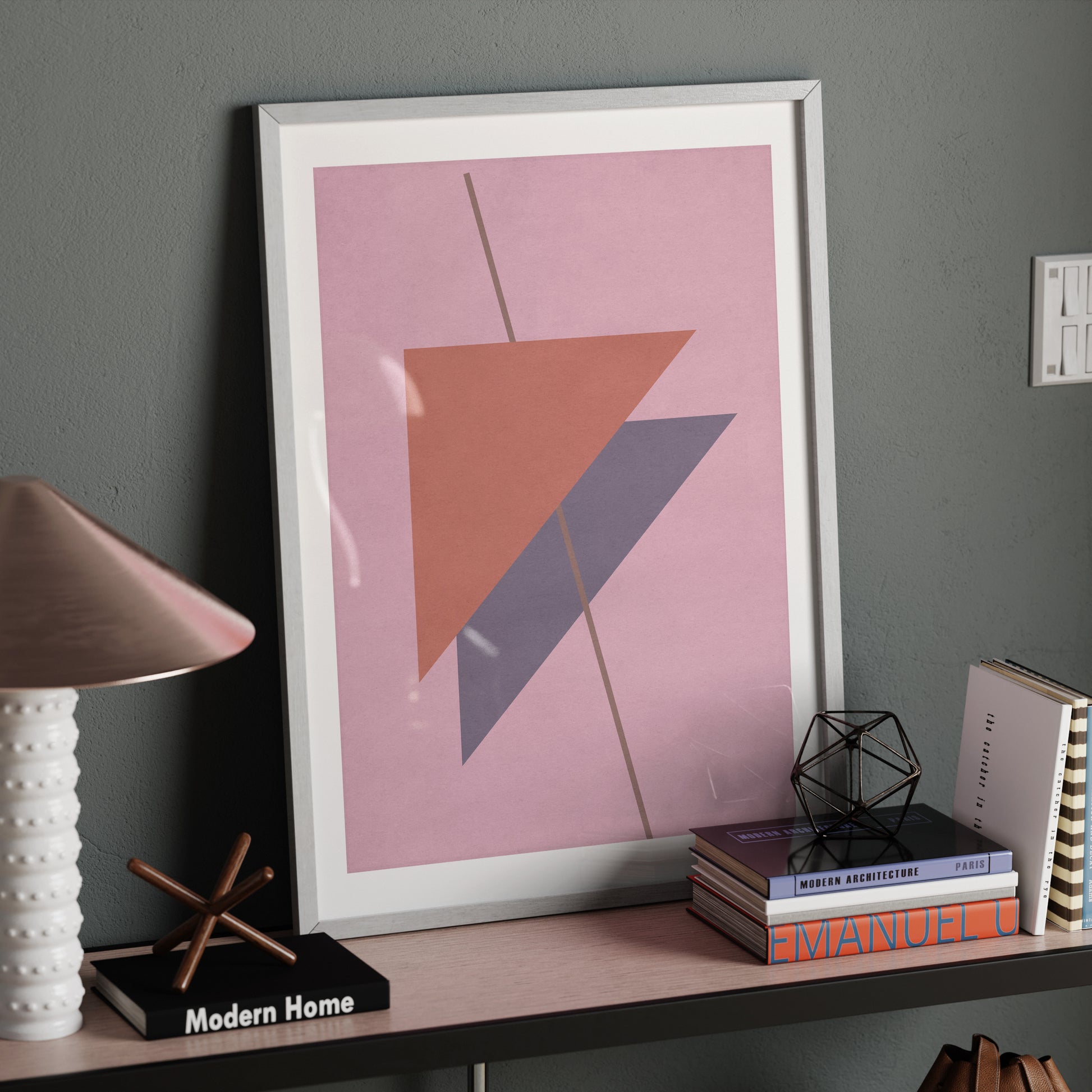 Pink abstract graphic art print on a modern sideboard.