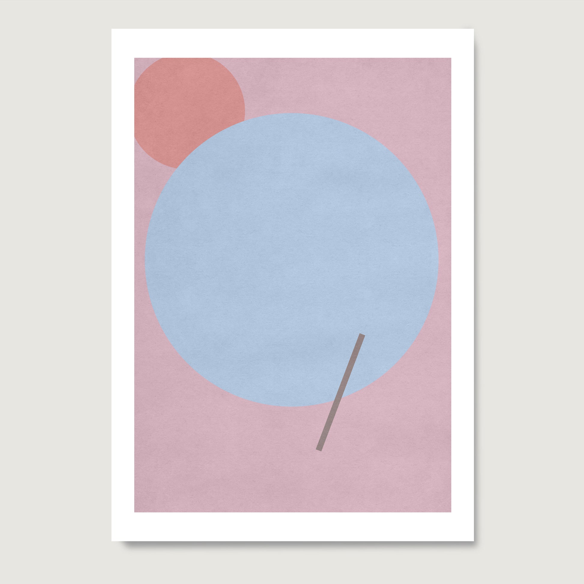 Pink graphic art print with a blue circle, on paper.