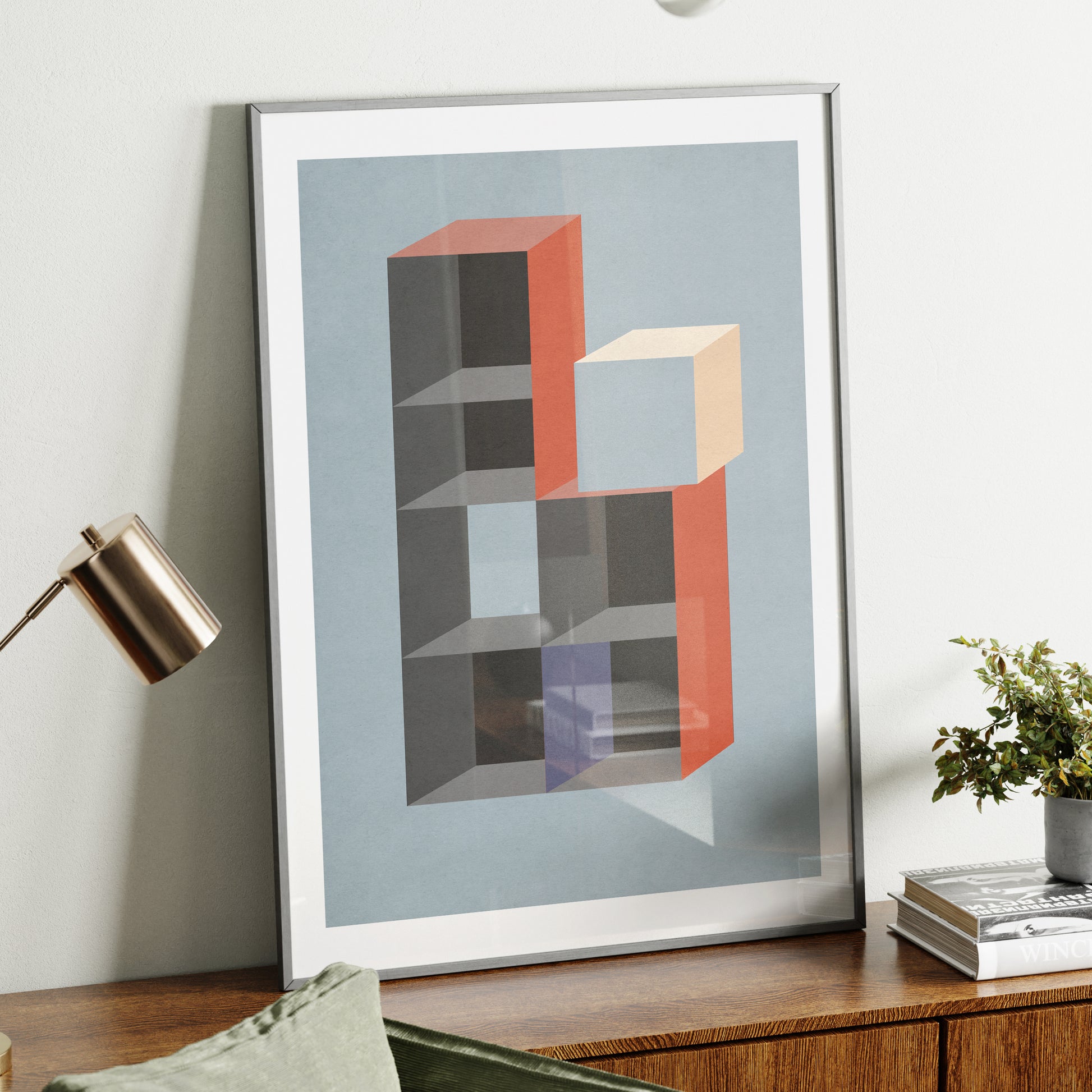 Moody geometric graphic art print on a sideboard.